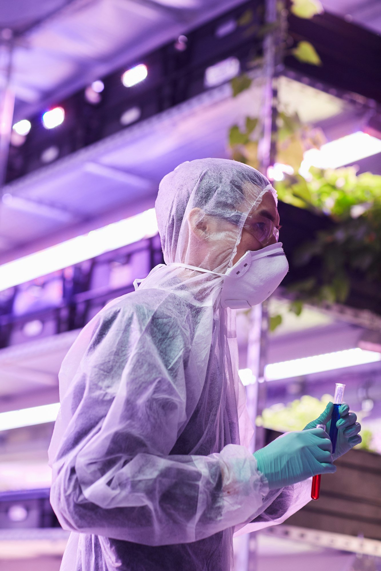 Botanist with test tubes in the lab